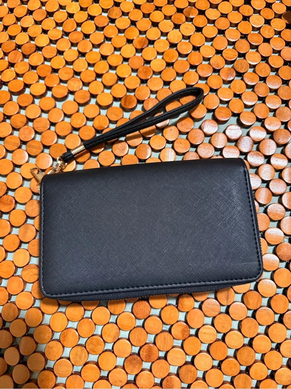 Classic Black Wristlet Clutch with Decorative Gold Emblem